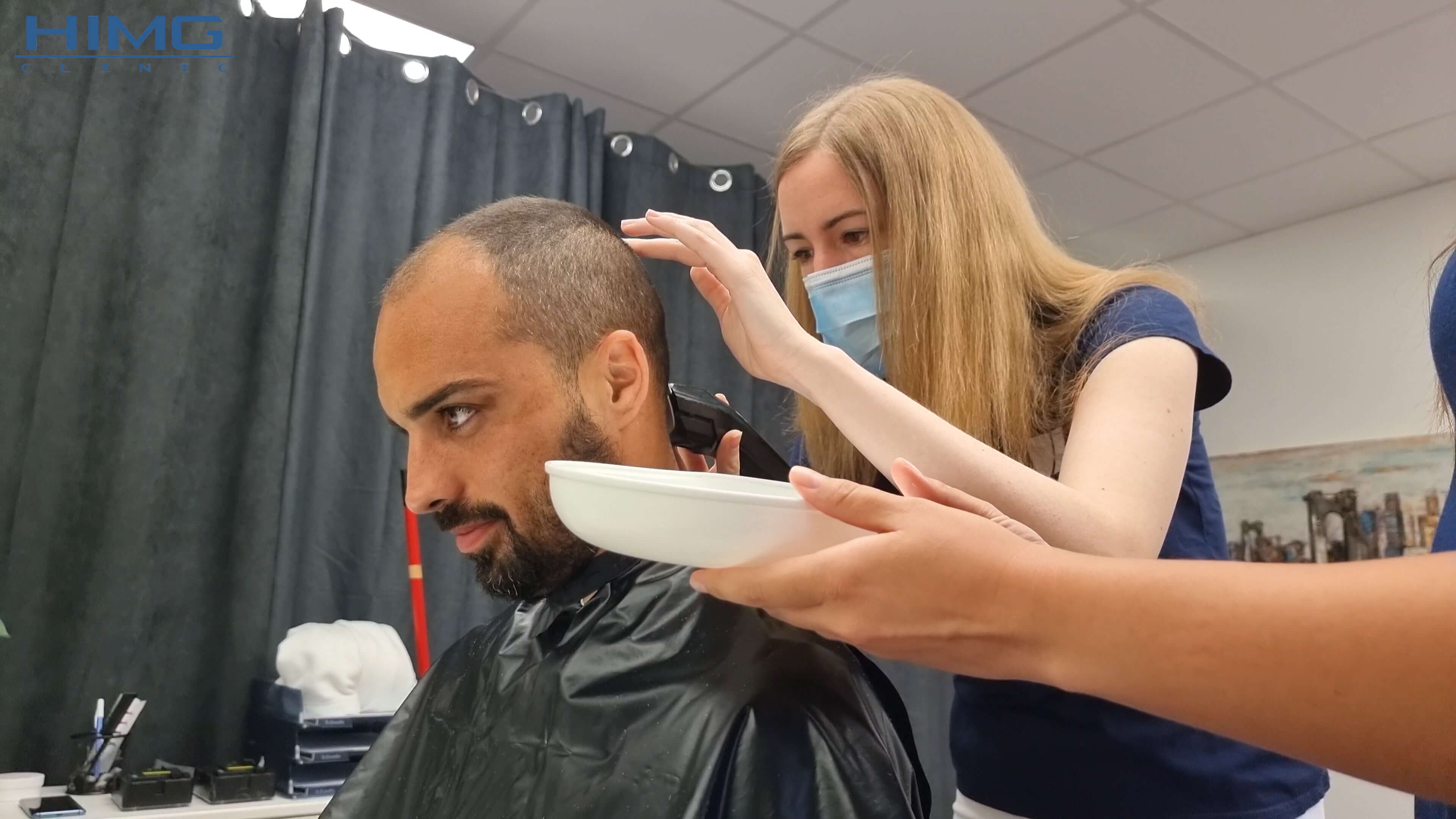 During haircut at the HIMG Clinic